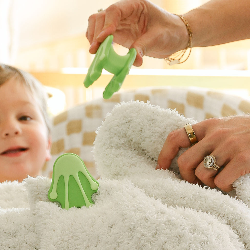 Safe silicone clips helping kids build blanket forts at home, recommended baby registry 2026”