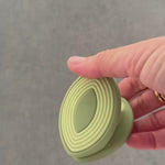 wind in motion, squeezing soft silicone clip. opens wider than traditional clips to grip irregular items.