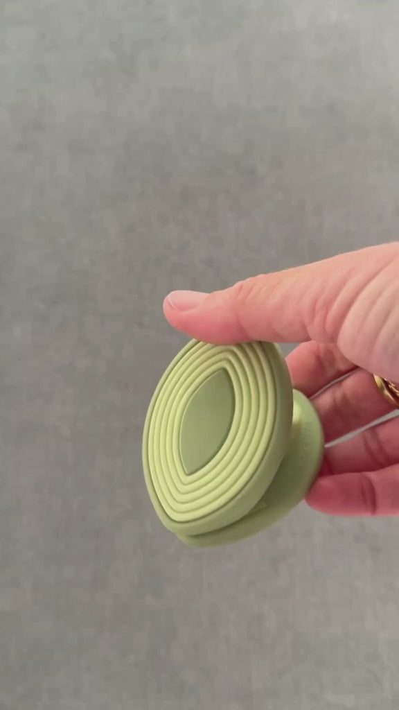 wind in motion, squeezing soft silicone clip. opens wider than traditional clips to grip irregular items.